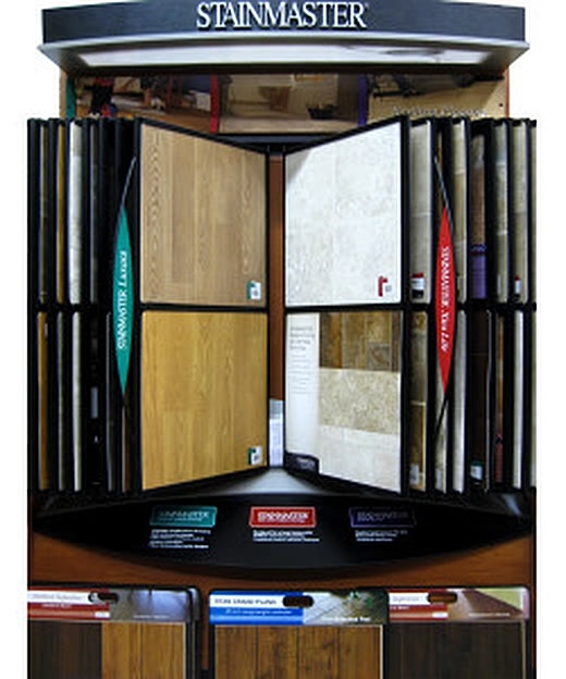 Open sample display of wood and stone panels in the Bellingham showroom.
