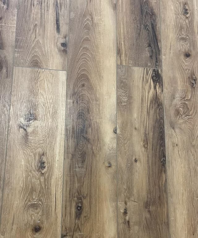 Weathered oak-look plank flooring, installed.