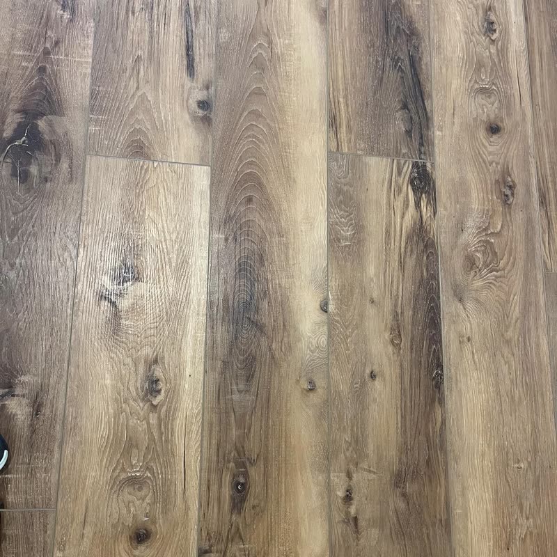 Close-up of the same plank flooring, showing the run of the boards and the
                  seams between courses.